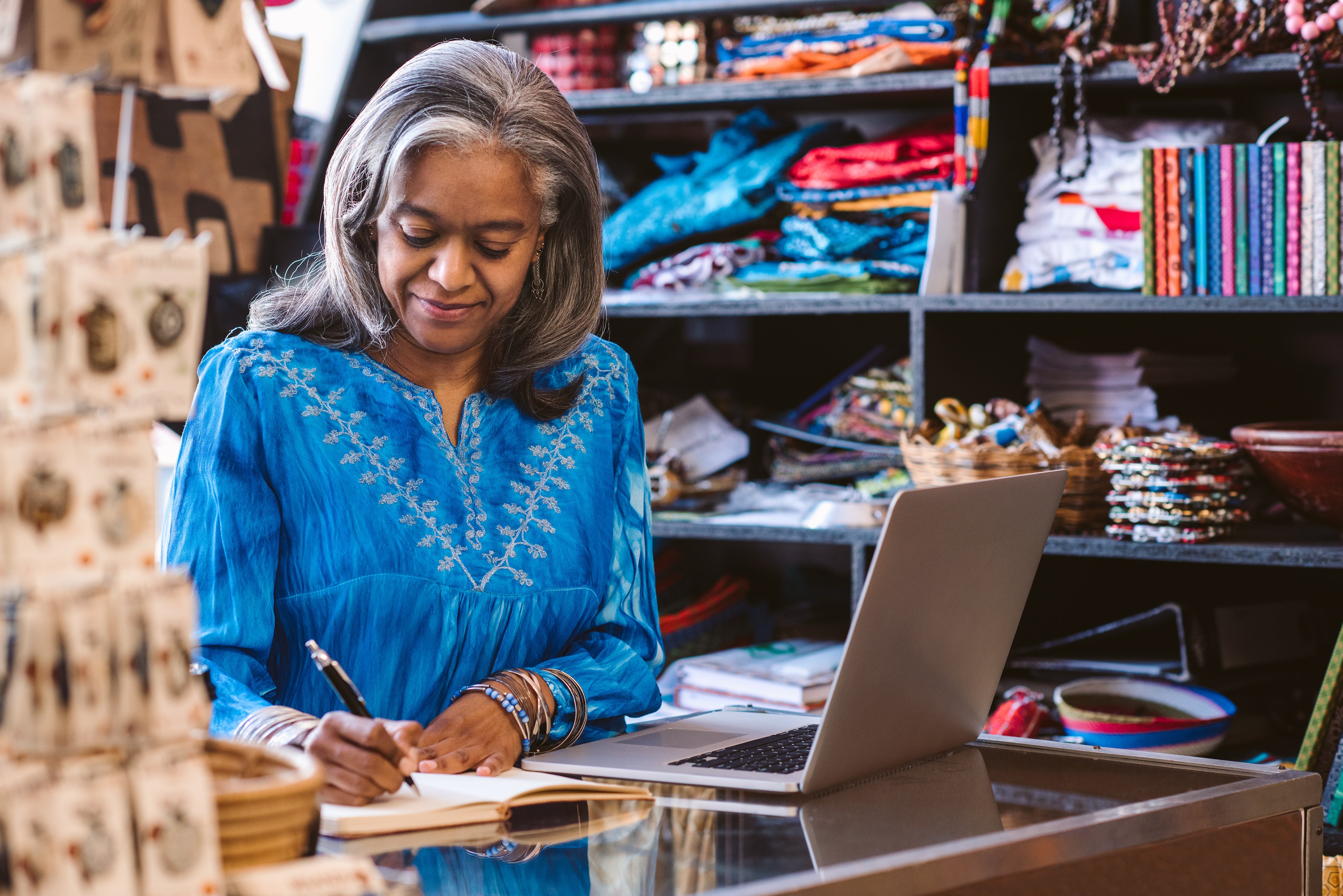 business owner writing down notes