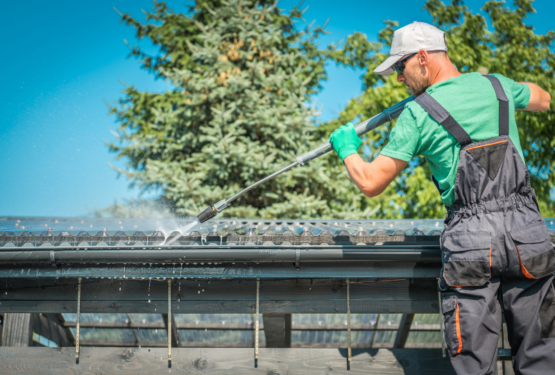 a-gutter-cleaning-technician-power-washing